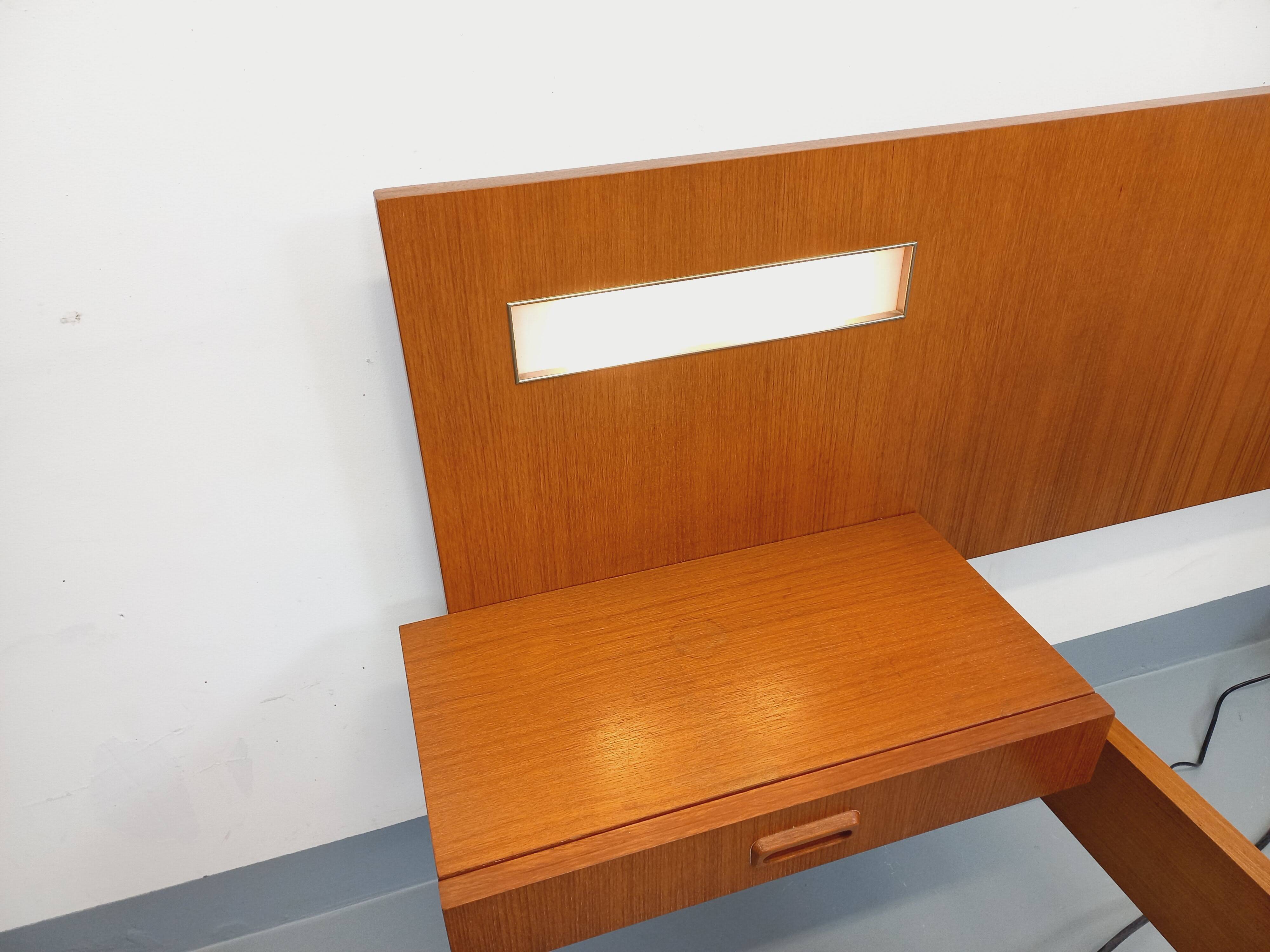 Double bed in vintage Scandinavian style from the 1960s with bedside tables.
