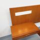 Double bed in vintage Scandinavian style from the 1960s with bedside tables.