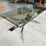 A chrome-shaped table and a 70s glass tray