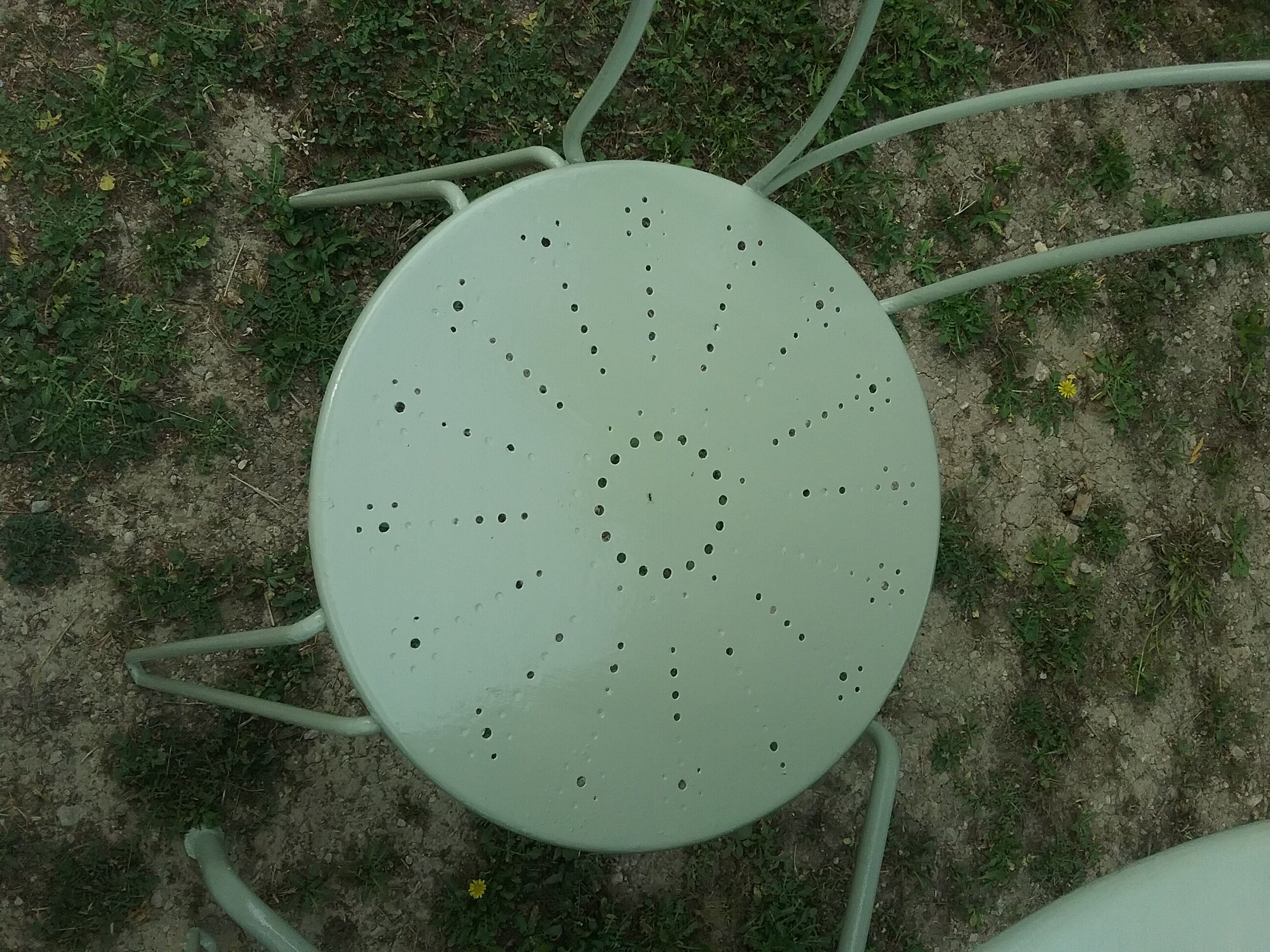 Green wrought iron garden furniture