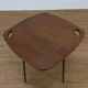 Modernist side table, 1950s, wood and metal, with handles.