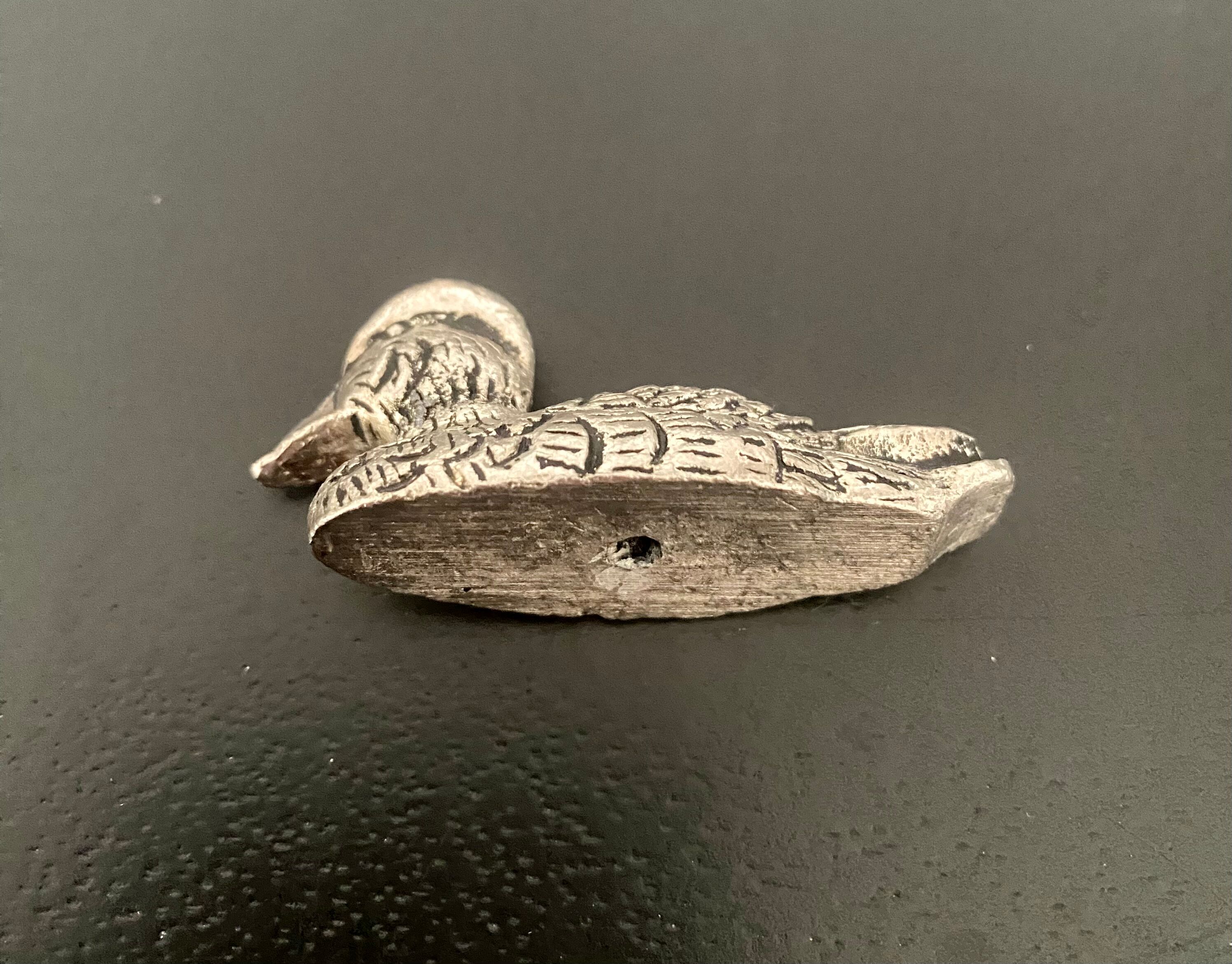 12 metal duck-shaped knife holders