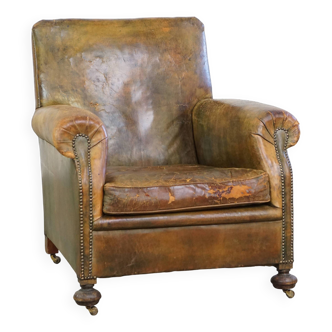 Green antique English cowhide leather armchair on wheels
