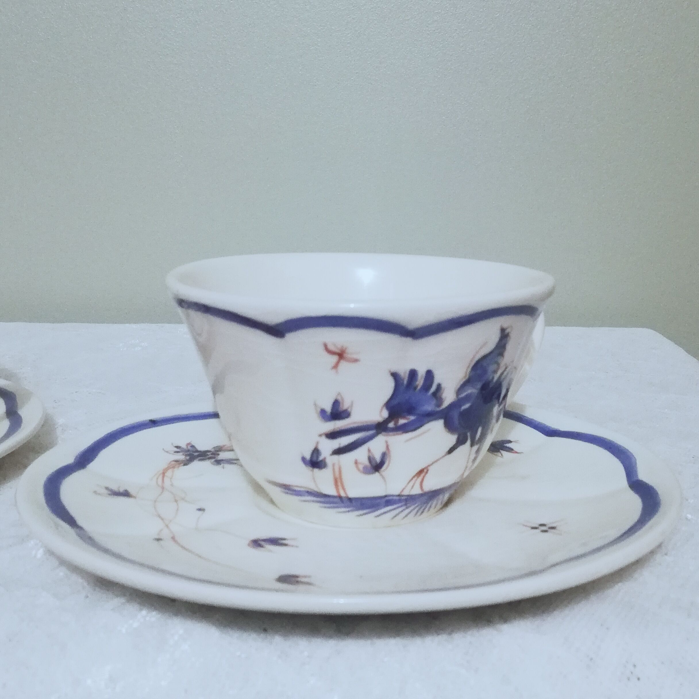 Two ceramic cups by Grignan signed Peguet