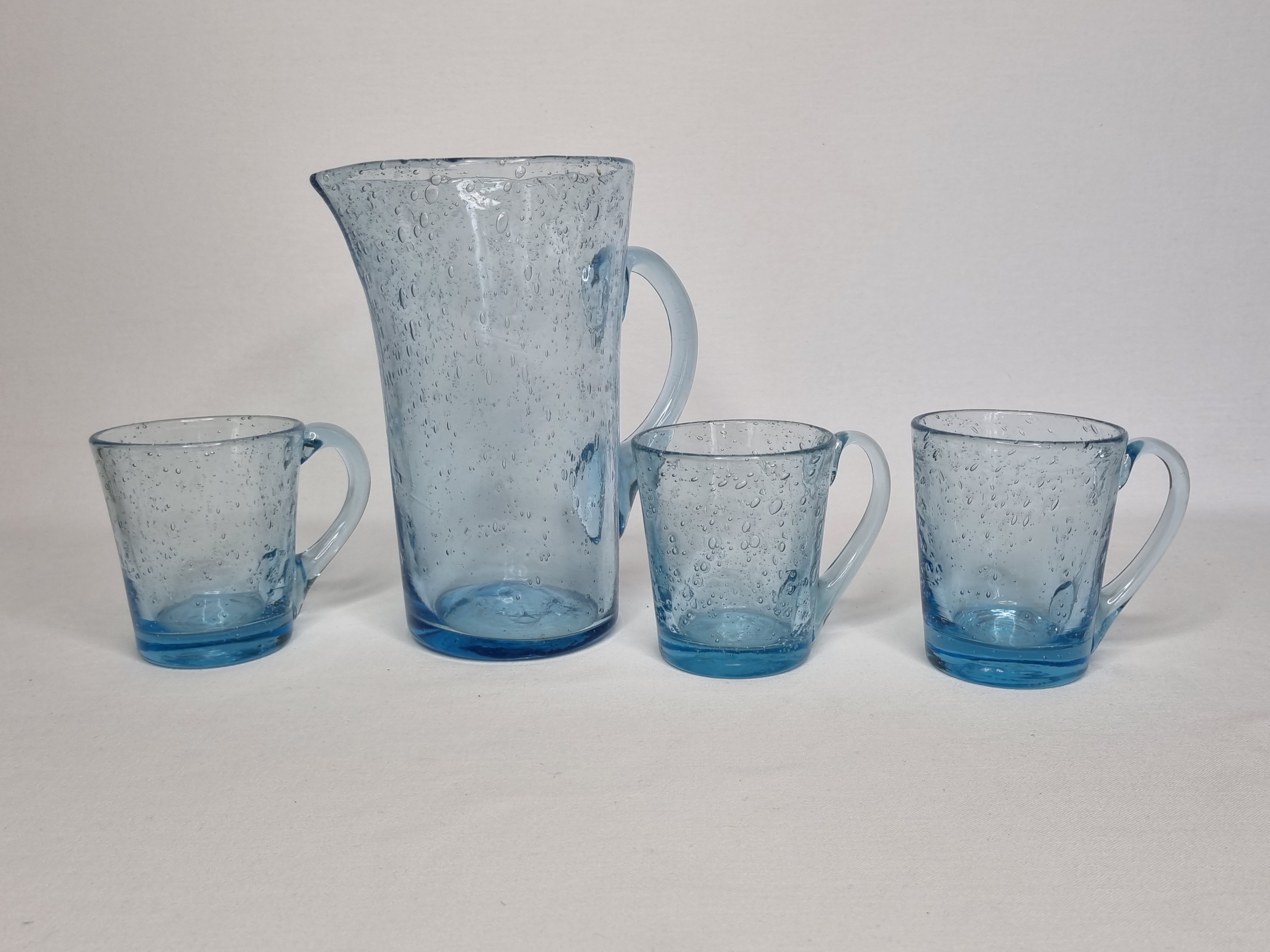 Orangeade service in bulled glass, a carafe and three glasses, Biot glassware