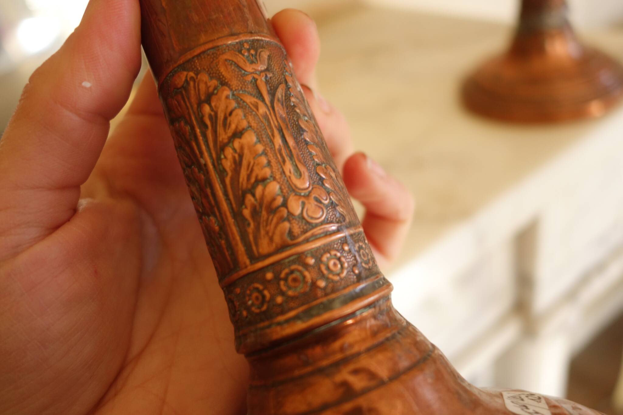 Pair of antique copper candlesticks