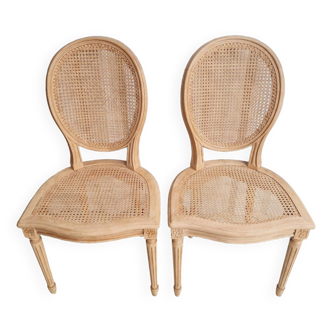 Set of two solid wood and cane chairs