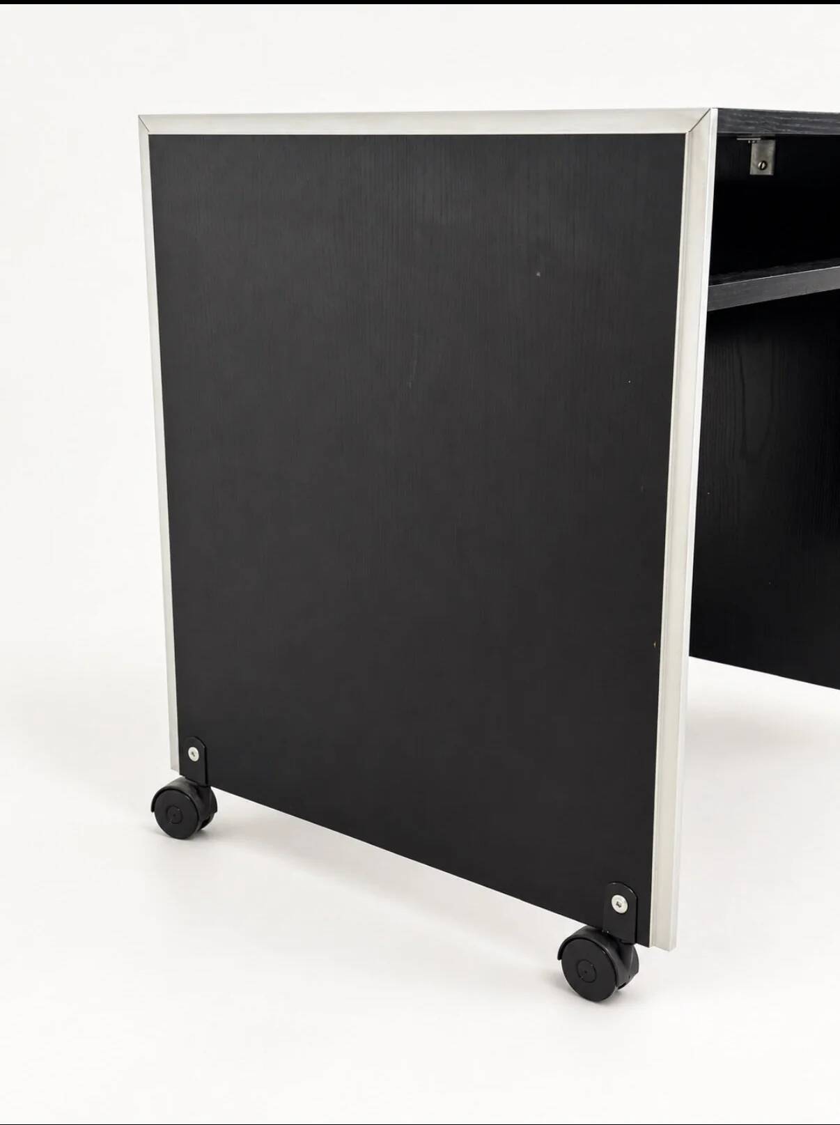 Vintage black computer desk on wheels with an aluminium edge.