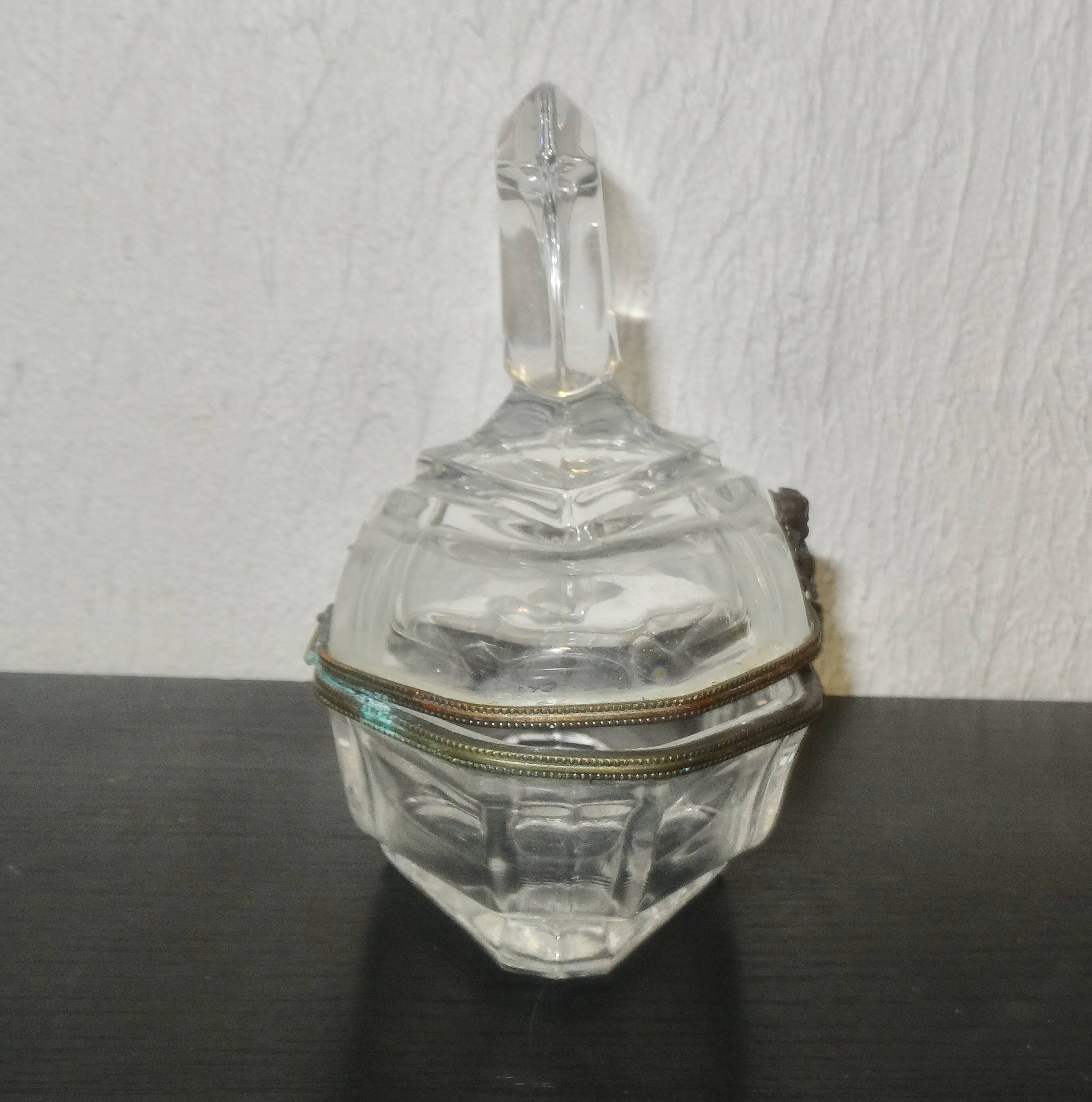 glass jewelry box with brass cherub decoration