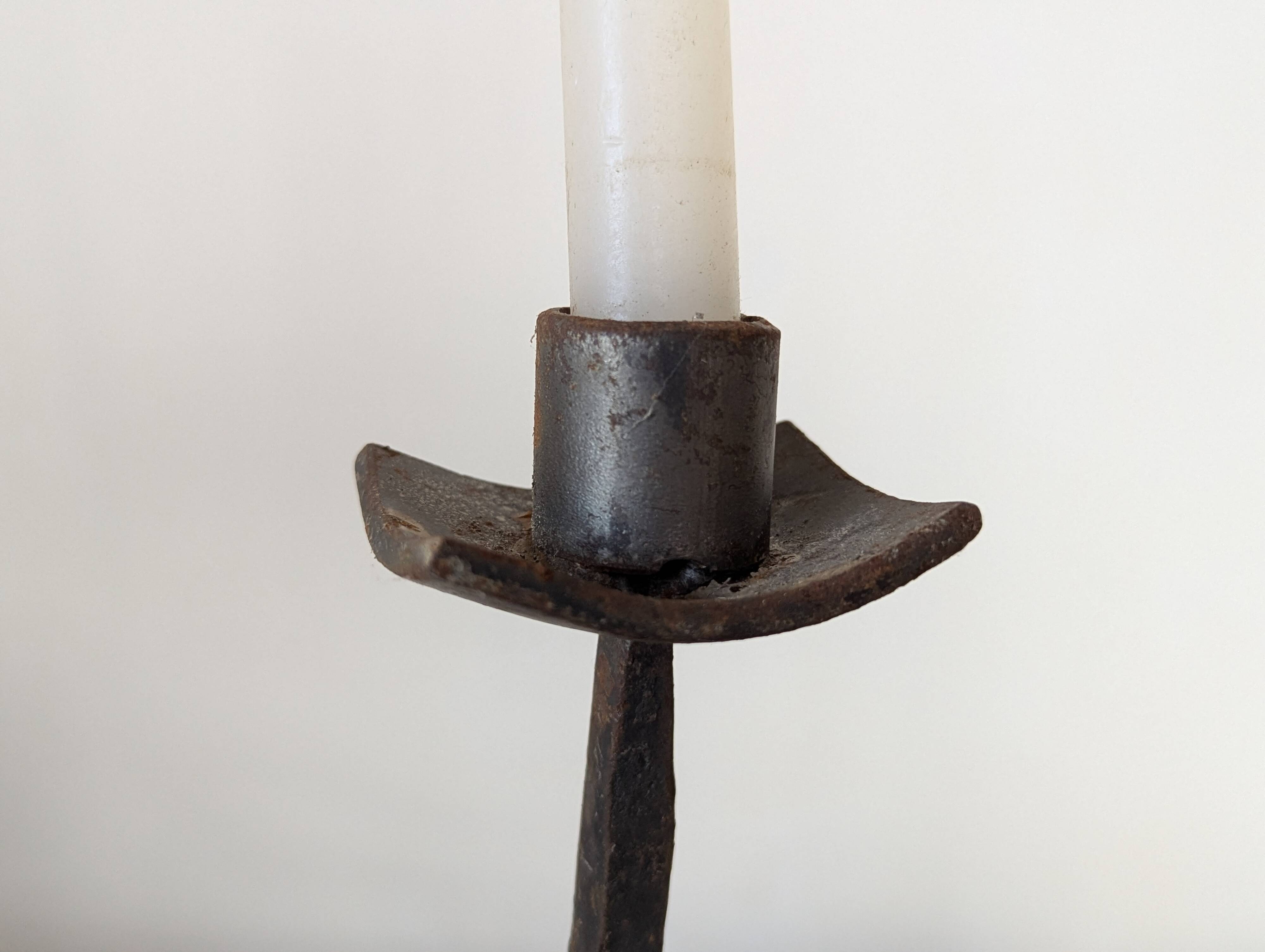 Pair of wrought iron candlesticks
