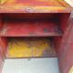 Old atypical metal workshop furniture with its original red patina