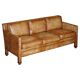 Three-seater leather canapé in Edwardian style with studs.