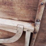 Oval table of grape harvesters from the Southwest in cherry wood