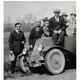 Photograph of a Renault 6CV with 23 admirers including a priest