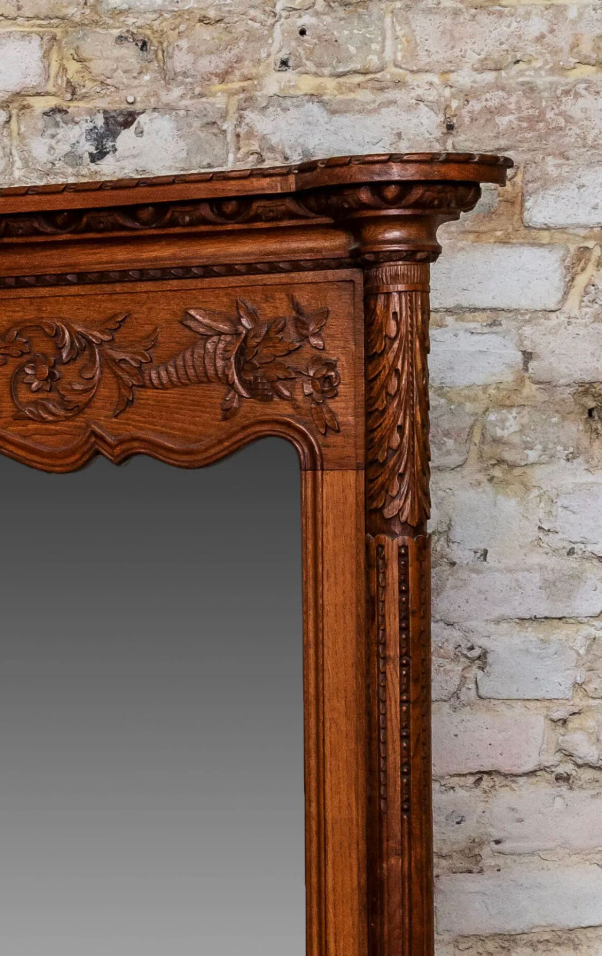 Beveled mirror in carved oak early twentieth century