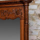 Miroir biseauté en chêne sculpté début XXème