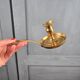 Vintage brass cellar rat, geometric handle in Art Deco style.