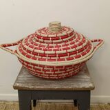 Red and beige woven basket with lid