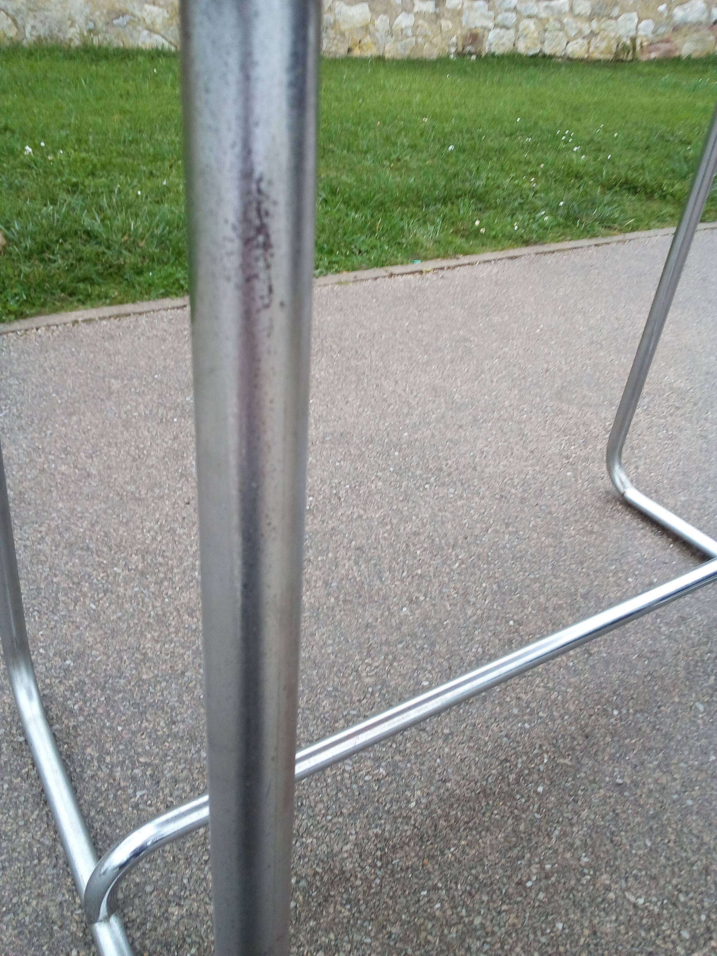 Old table in chrome steel and wood