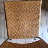 Glass and metal table and its 4 wicker chairs and glass Roche Bobois