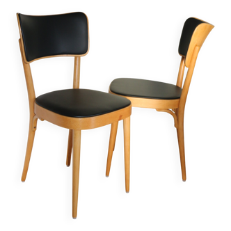 2 BAUMANN chairs with wide backs in black faux leather.