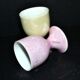 Set of 2 vintage pastel porcelain egg cups - yellow and iridescent pink