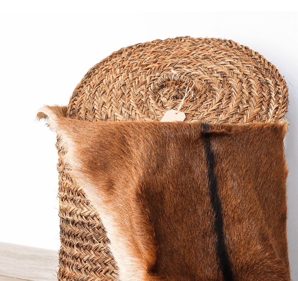 Hand-woven laundry basket in natural rush