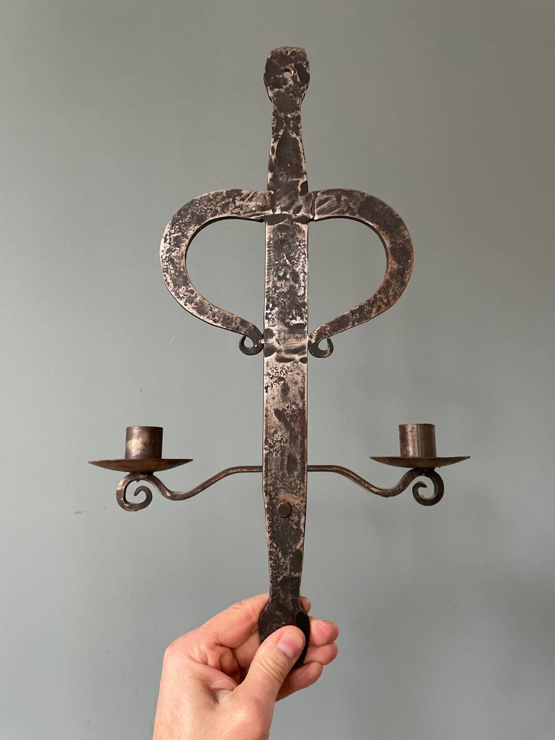 Brutalist wrought iron wall candle holder