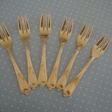 Golden metal cake forks