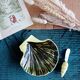 St-Clement shell-shaped butter dish and knife
