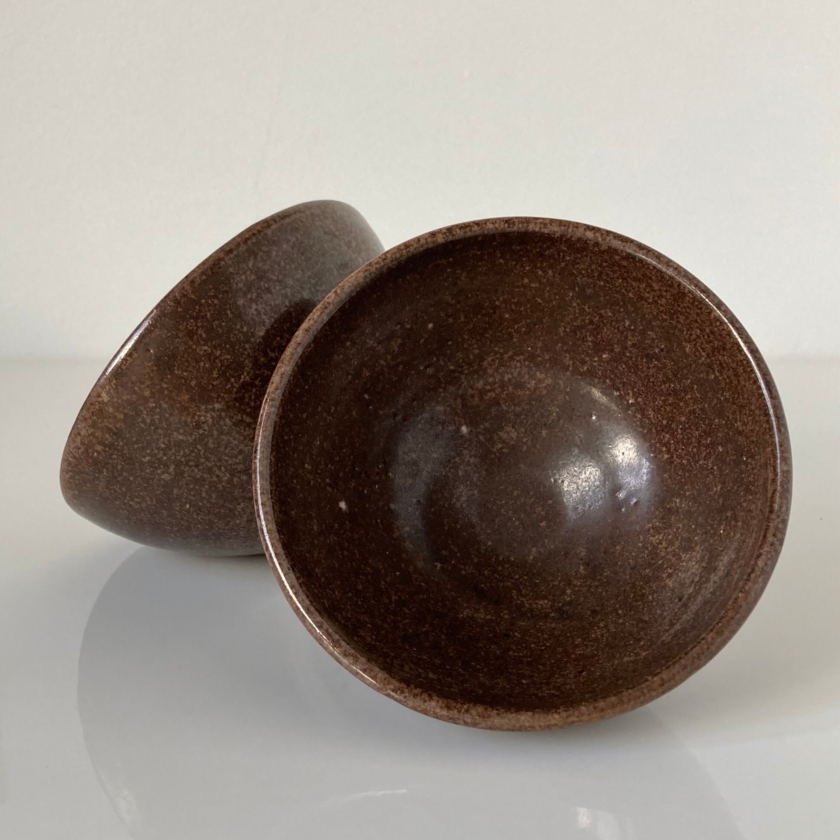 Pair of Japanese temoku bowls in brown glazed stoneware