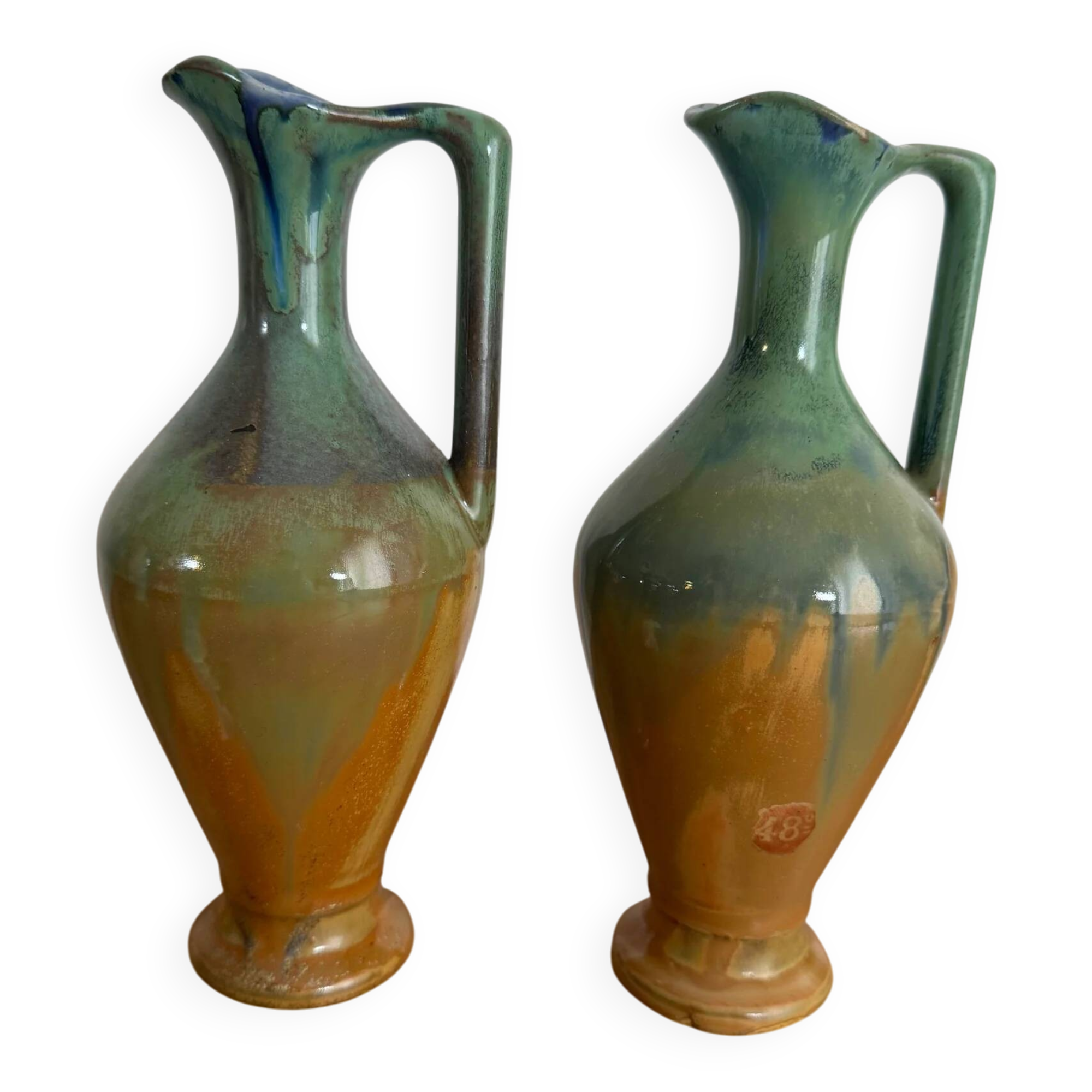 Set of 2 signed ceramic jugs