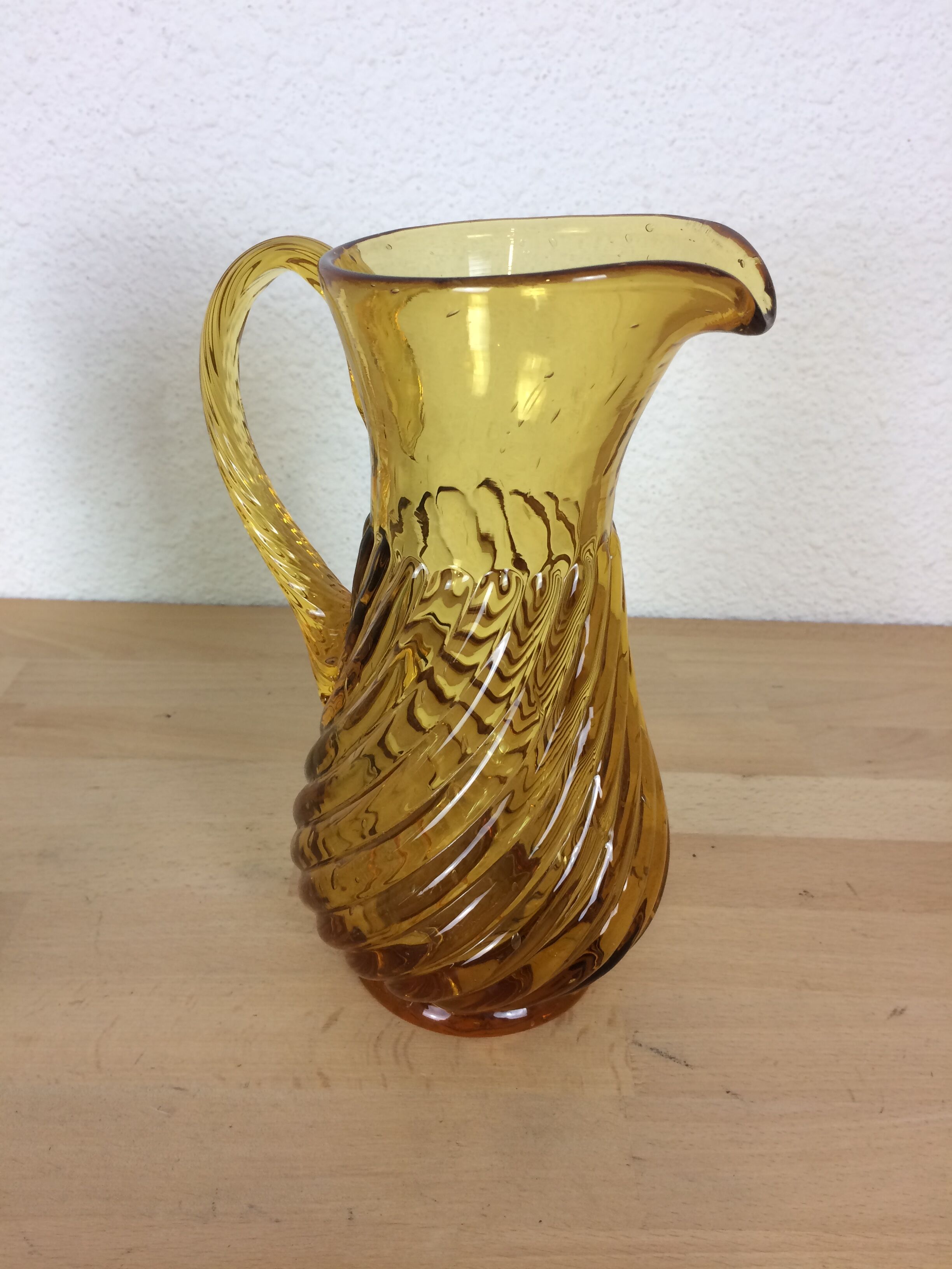 Twisted amber glass pitcher