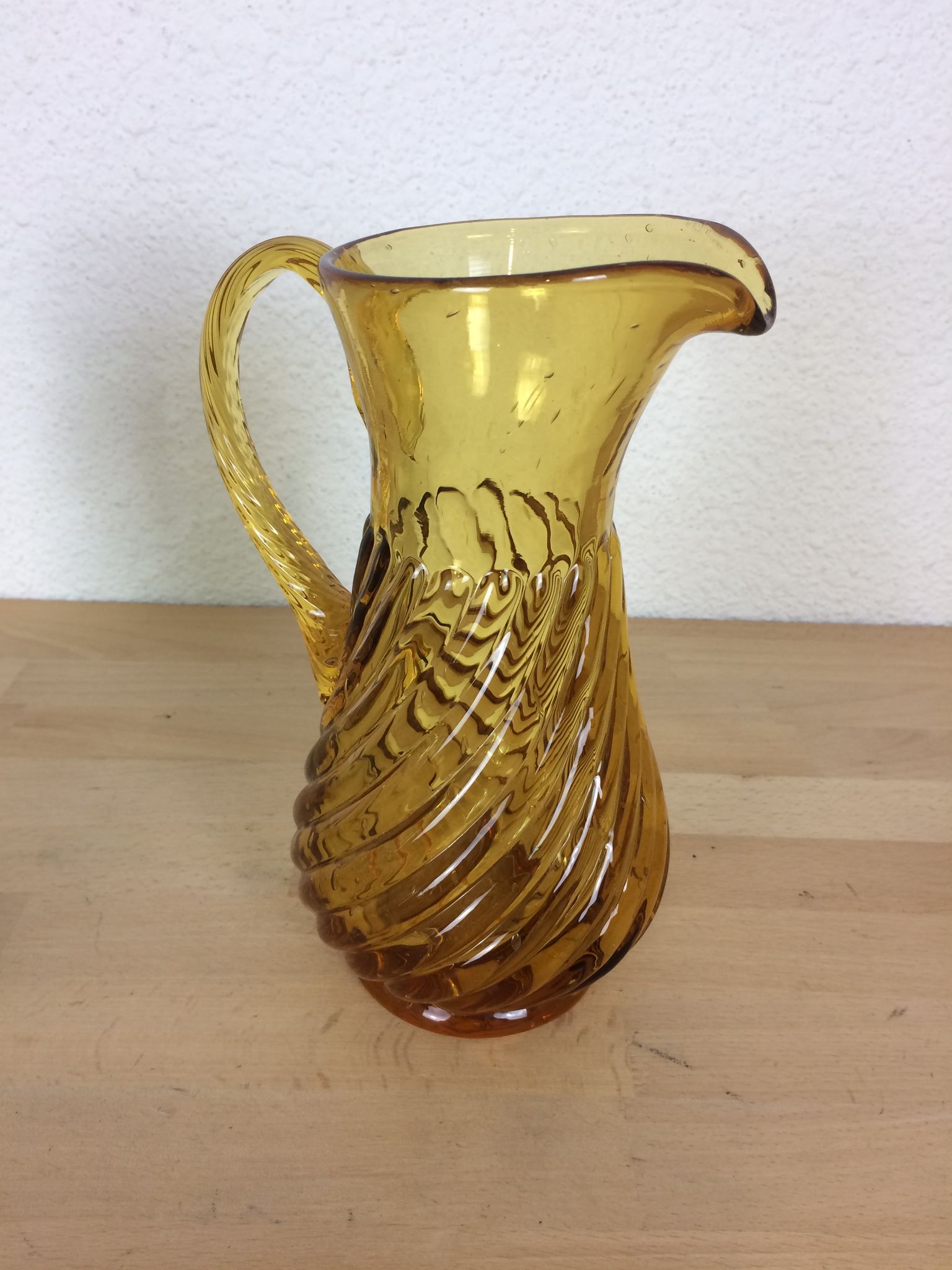 Twisted amber glass pitcher