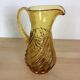 Twisted amber glass pitcher