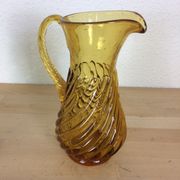 Twisted amber glass pitcher