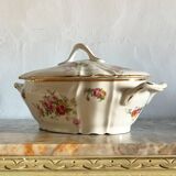 Antique porcelain soup bowl with floral decoration and golden border