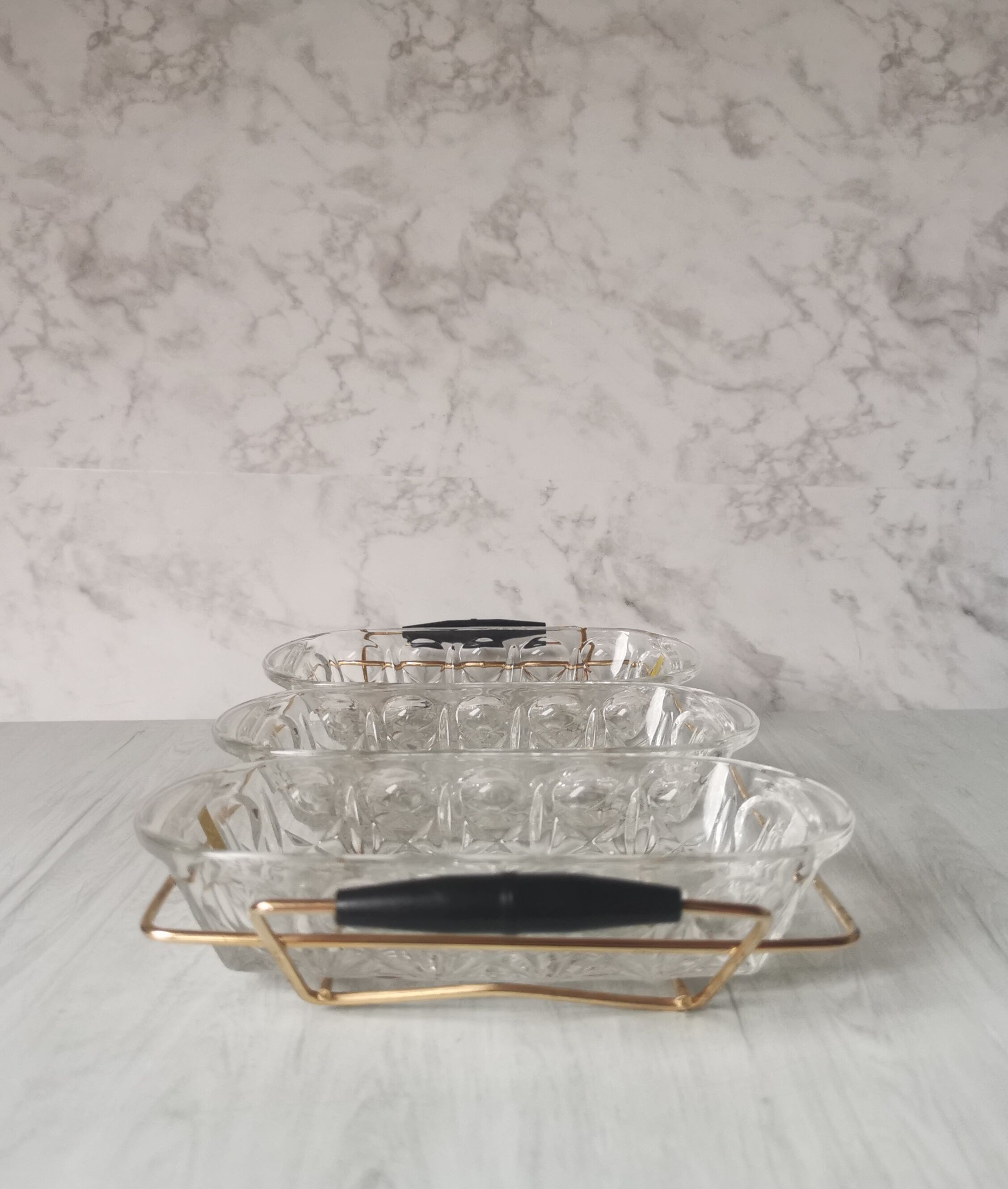 Tray with glass and gold metal compartments