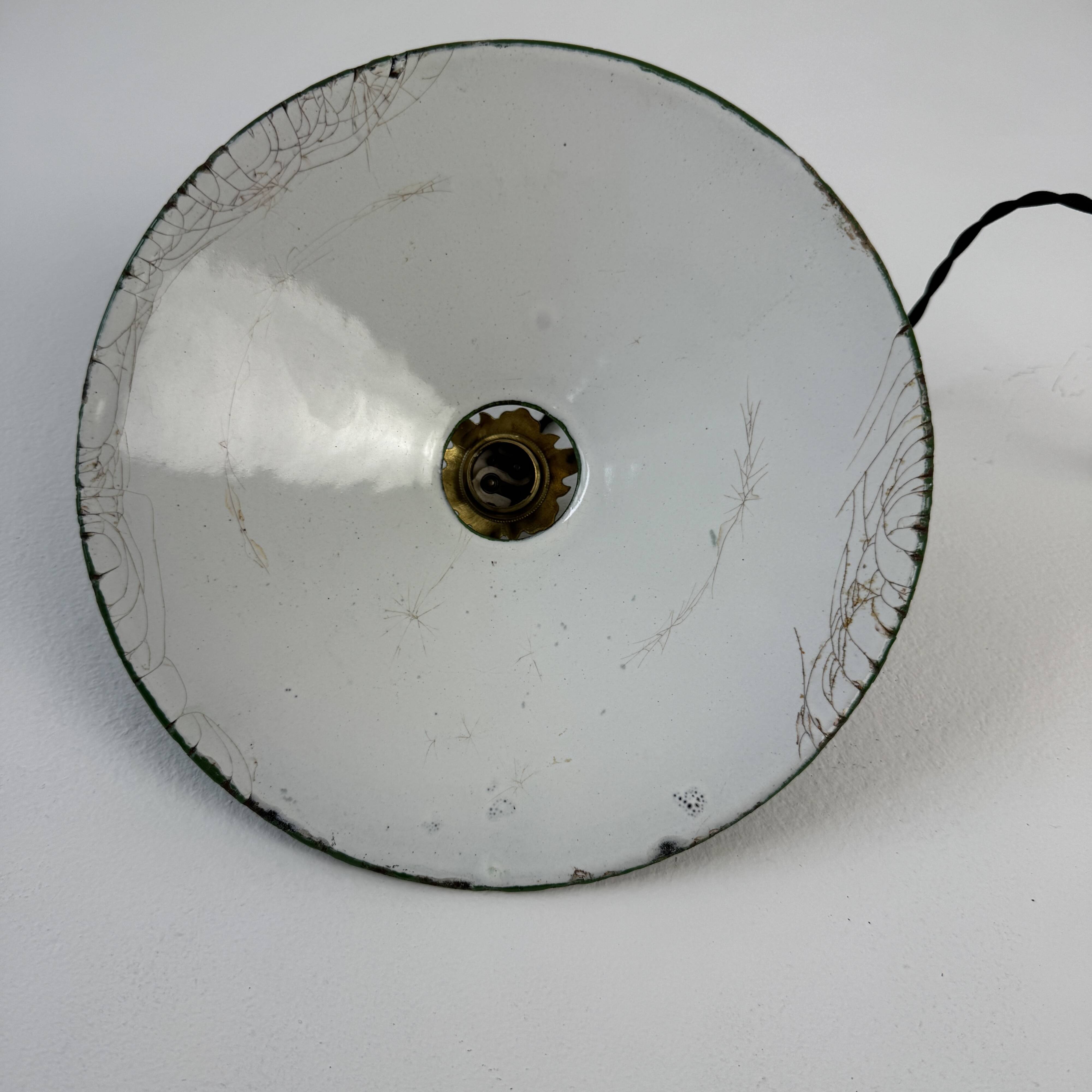 Old conical industrial pendant light in green enamelled sheet metal
