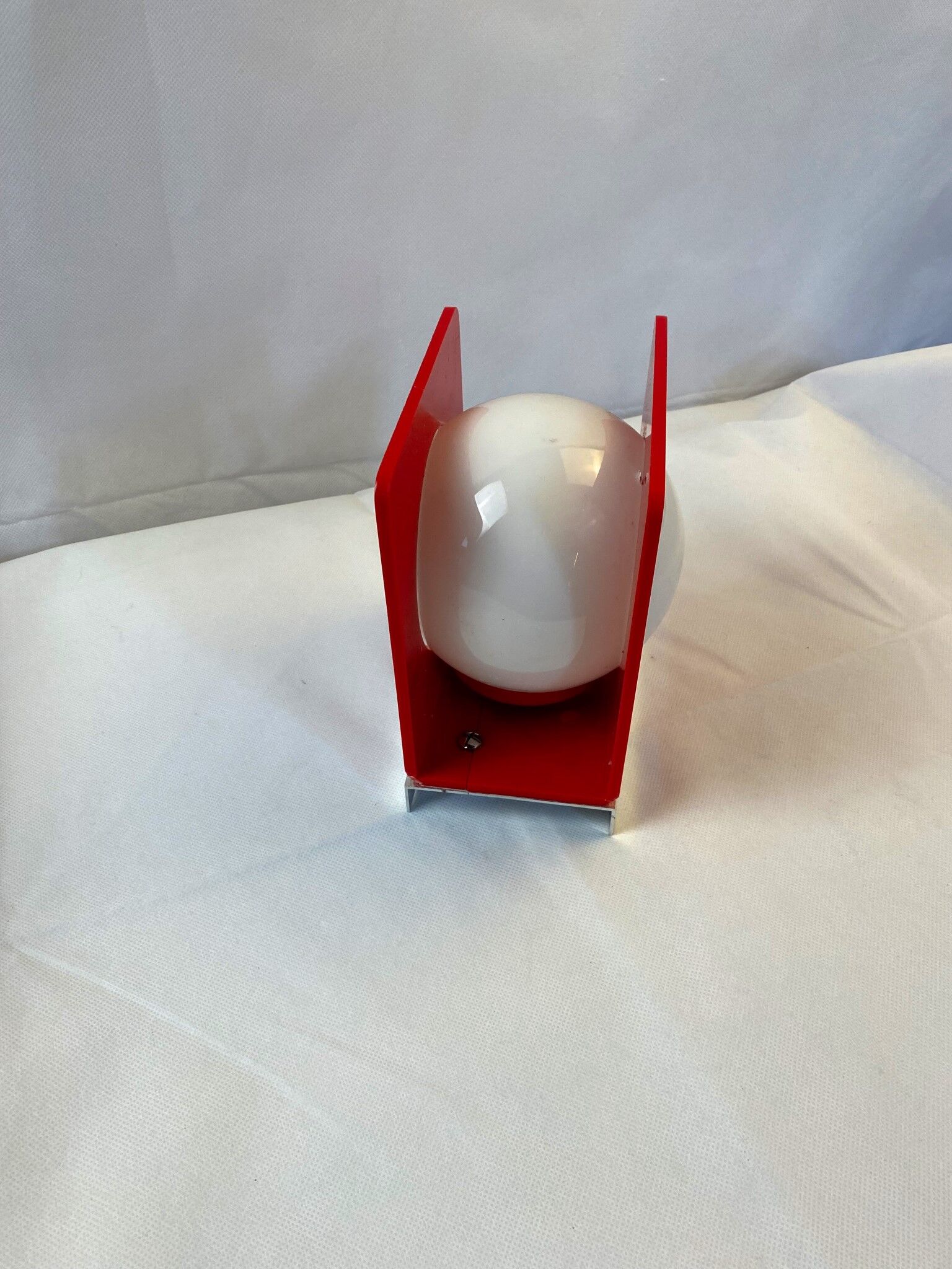 Wall lamp from the 60s in red plastic with white globe