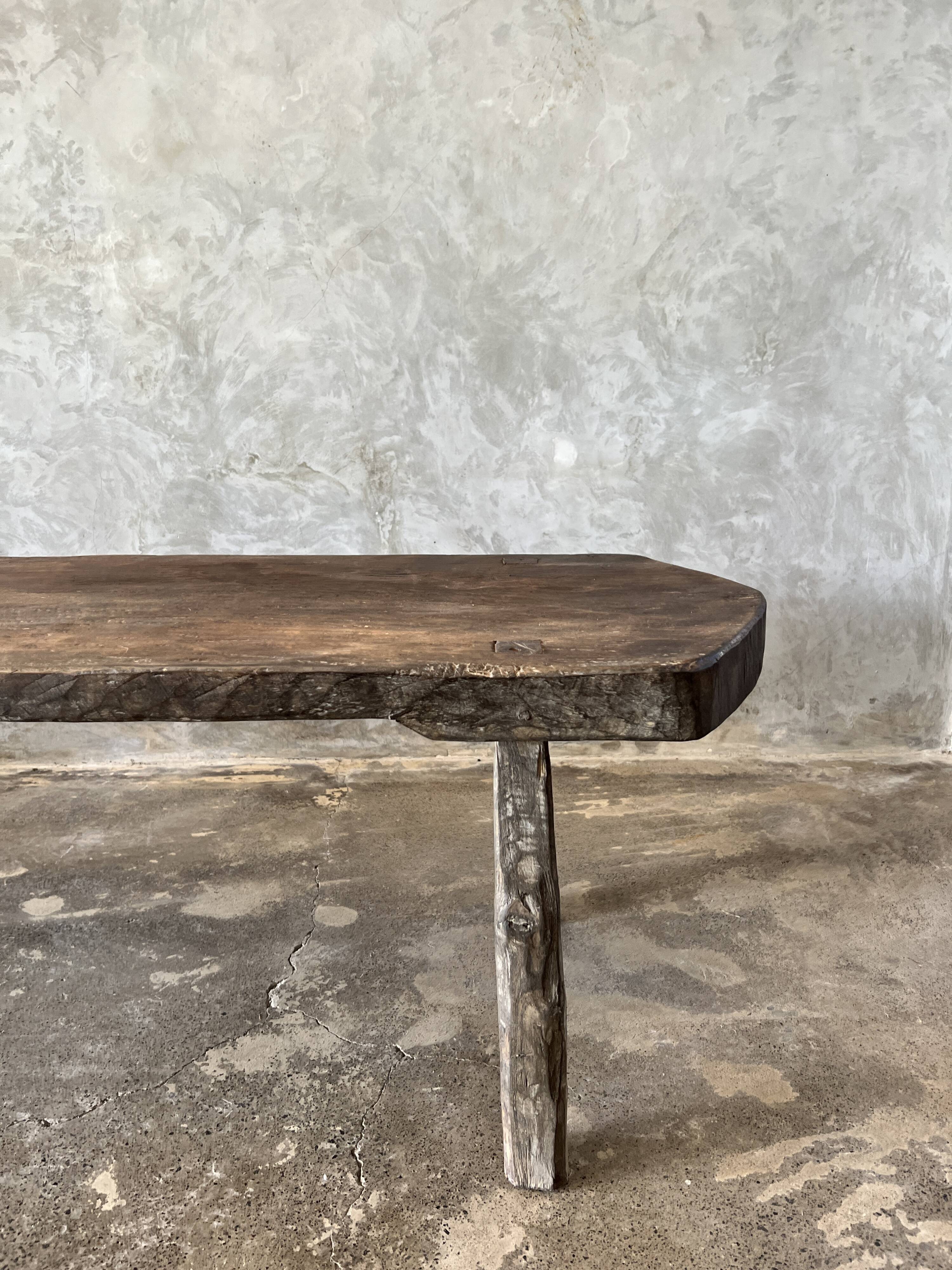 Large rounded coffee table in old Asian teak