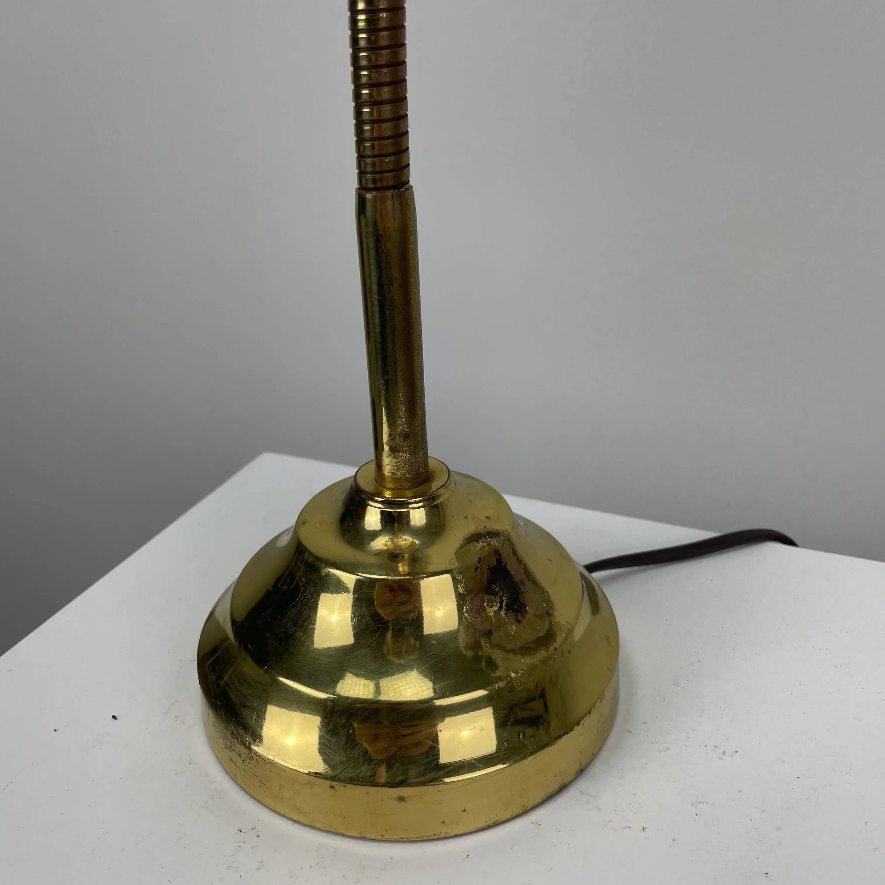 French table lamp in brass with a shell-shaped shade from the 1950s.