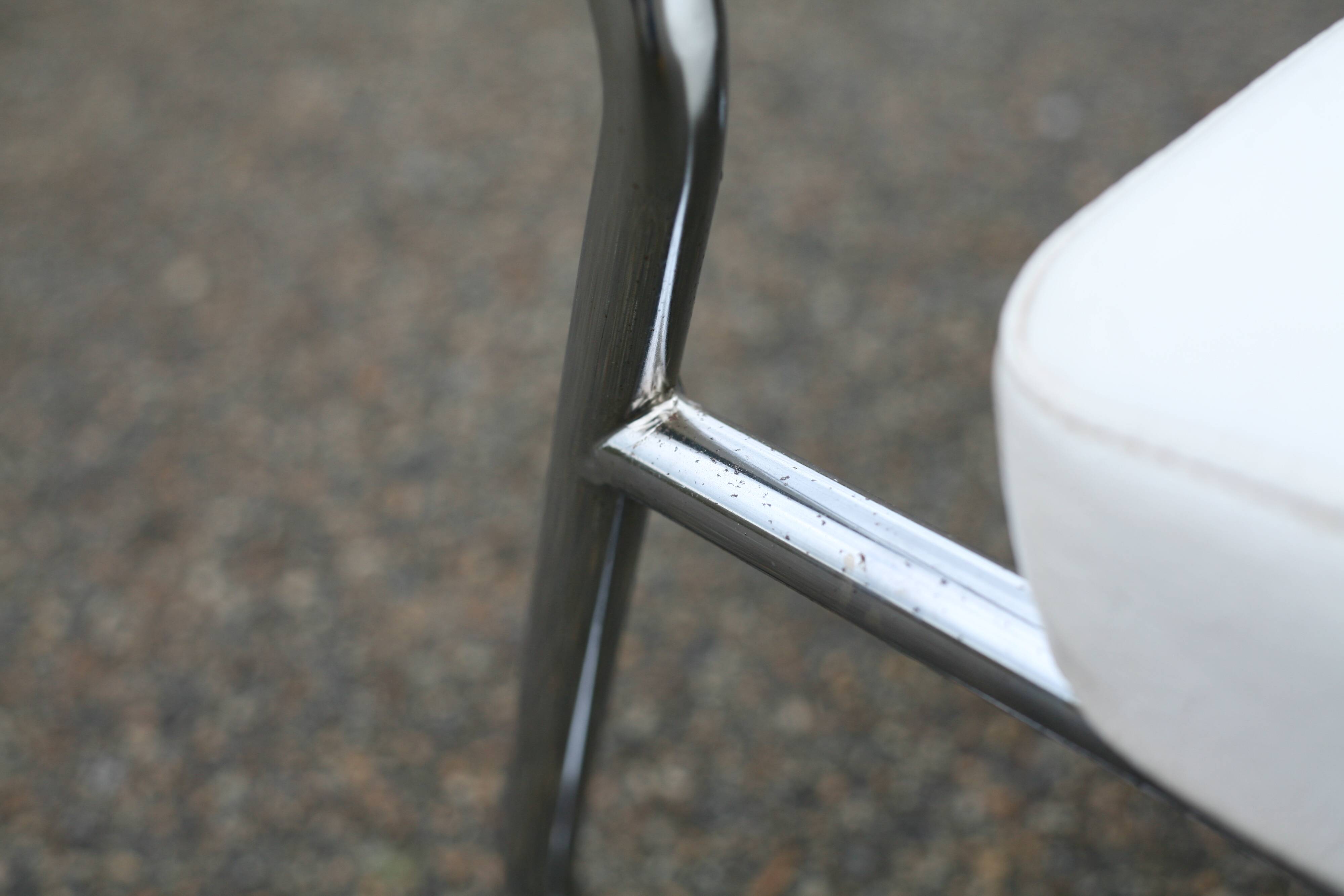 4 armchairs forming a modular sofa. Steel, imitation leather, 70s