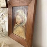 Old oil portrait on wood of a young woman