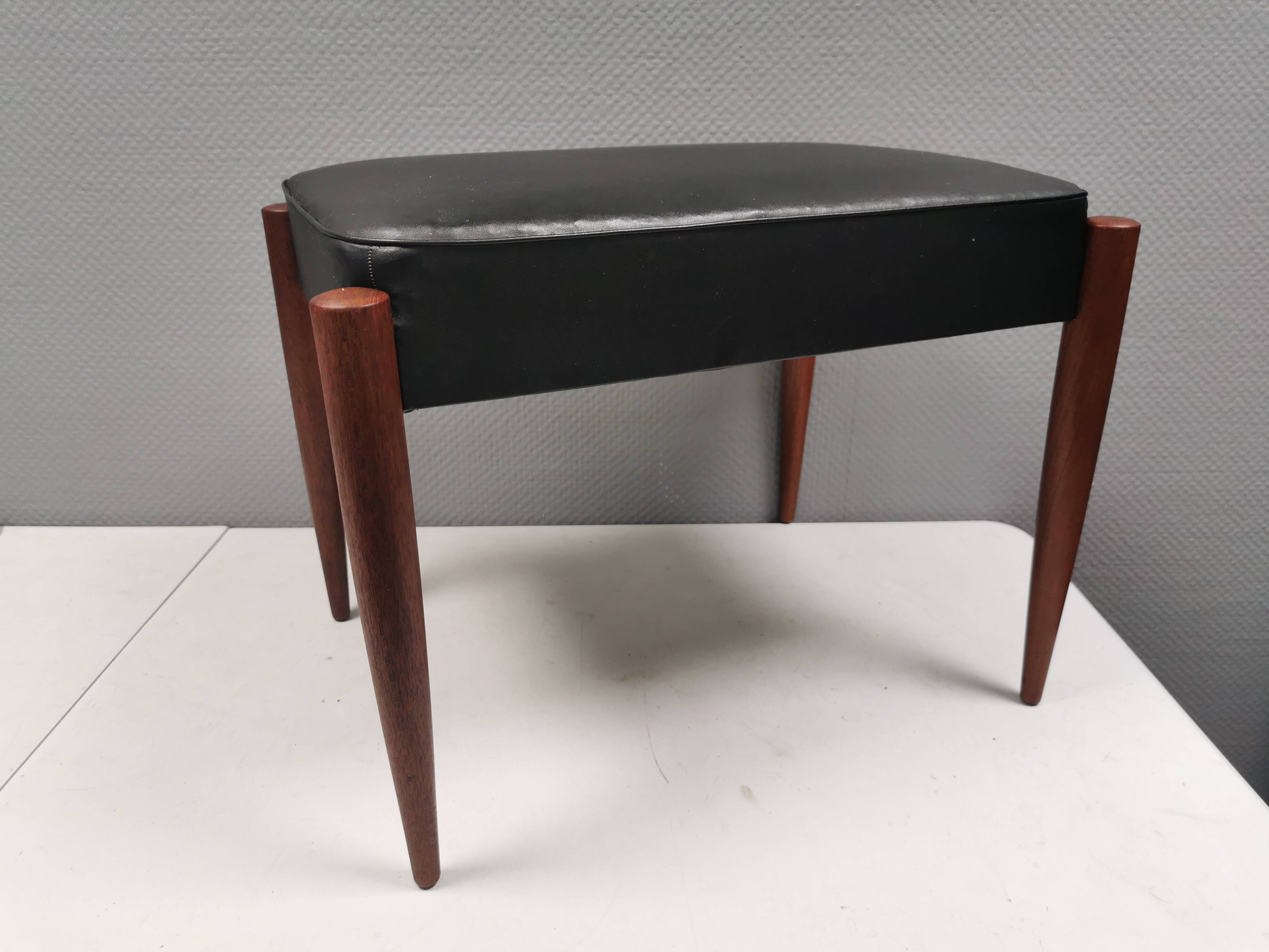 Footstool with teak wood legs and black skai (imitation leather) 1970s
