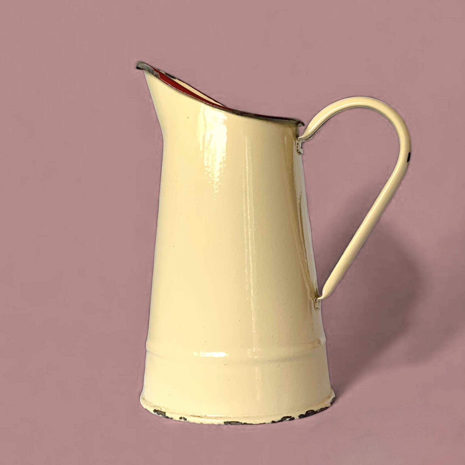 Vintage pitcher or jug in beige enamelled sheet metal