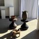 Small low circular four-legged stool in organic old teak with cut-out design H2
