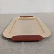 Plates and a brass and Bakelite cut by PM Italy, Italy around 1970.