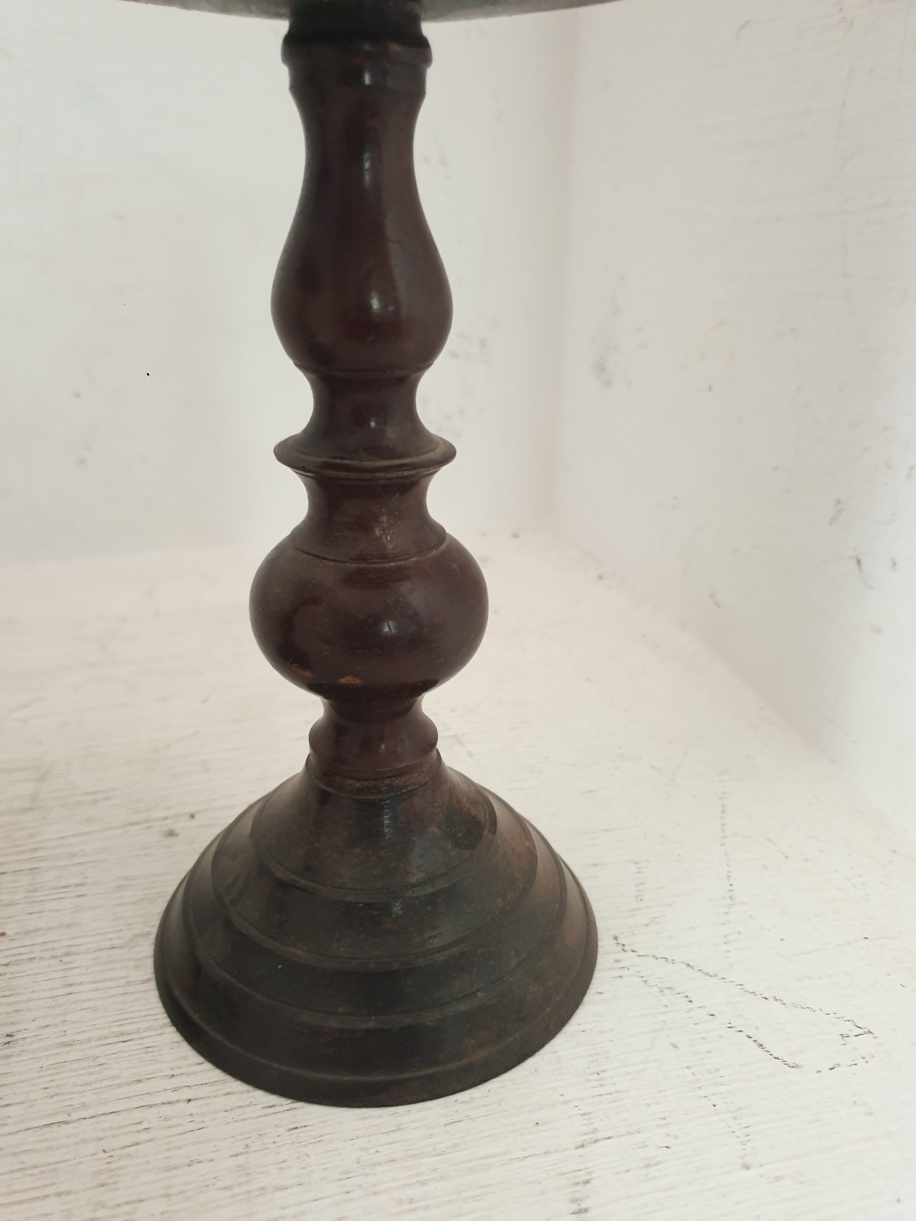 Two pairs of patinated brass candle holders