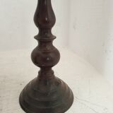 Two pairs of patinated brass candle holders
